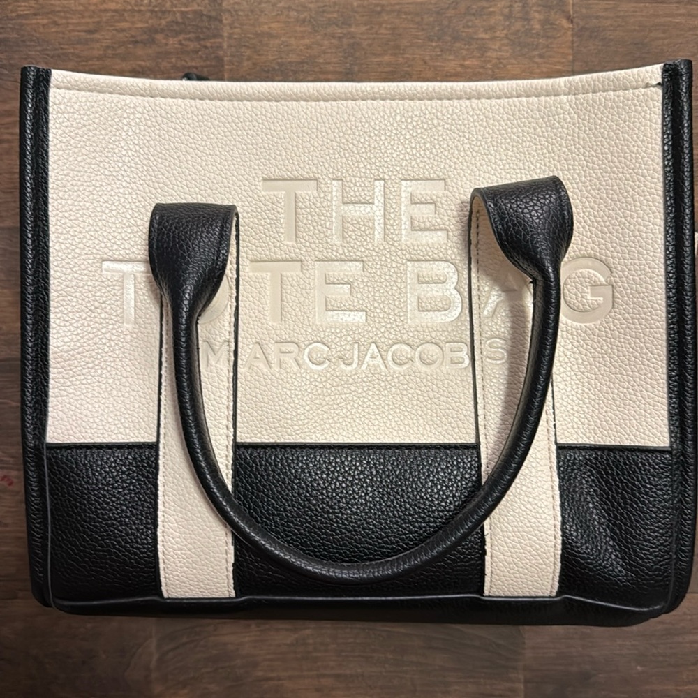 M J.  Cream and black tote.